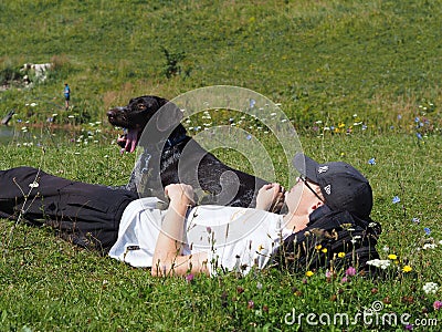A man with a hunting dog in a field. A man with a dog. Editorial Stock Photo