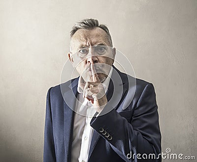 Man imposes silence in an arrogant way Stock Photo