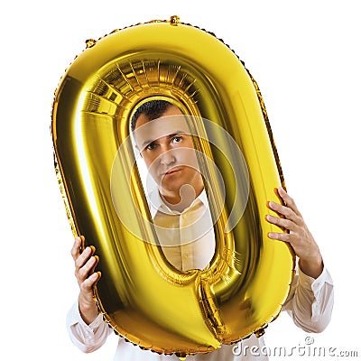 A man with an inflatable toy in the shape of a zero isolated on a white background. Zeroing concept Stock Photo
