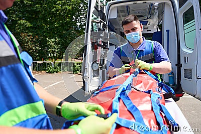 Man injured in accident is fixed by doctors on special stretcher Stock Photo
