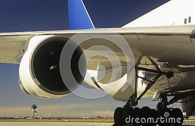 Man inspecting engine of passenger jet Stock Photo