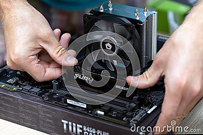 Man installing Fury Beast RAM DDR4 stick on professional computer. Russia, 17.08.2021 Editorial Stock Photo