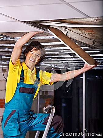 Man installing suspended ceiling Stock Photo