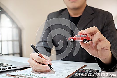 A Man Insurance broker offer protect your car. Stock Photo