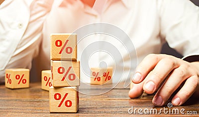 Man and interest rates. Interest rate on loan or deposit. Profit investments, dividends and yield on securities assets. Debt Stock Photo