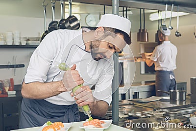 Man japanese restaurant chef cooking in the kitchen Stock Photo