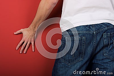 Man in jeans in back Stock Photo