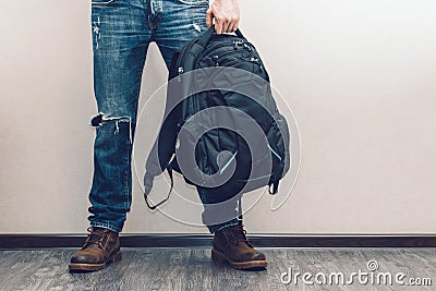 Man in jeans with backpack Stock Photo