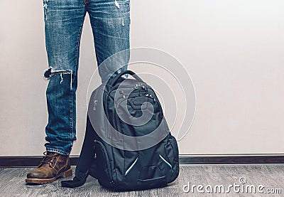 Man in jeans with backpack Stock Photo