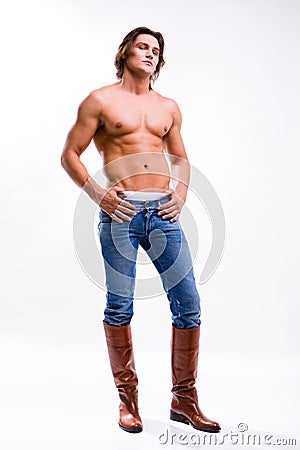 Man in a jeans and boots. Denuded torso Stock Photo