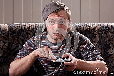 Man with joystick playing video games Stock Photo