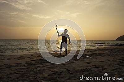 Man juggling on the beach Editorial Stock Photo