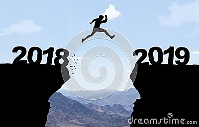 Man jumping over abyss with text 2018/2019 Stock Photo