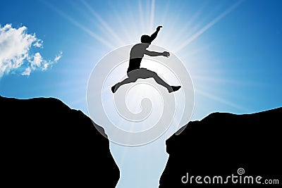 Man jumping over precipice. Risk, challenge, success. Stock Photo