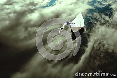 man jumping from a paper boat into the cloudy sky. Young male jumping off a boat, enjoying the freedom. Mixed media Stock Photo