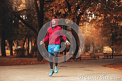 Man jumping rope outdoors on sunny morning Stock Photo