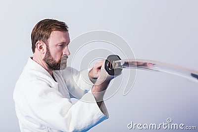 A man with katana on Iaido practice Stock Photo