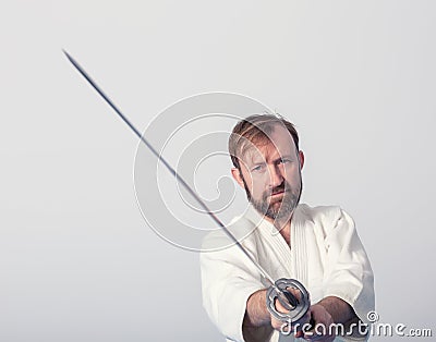 A man with katana on Iaido practice Stock Photo