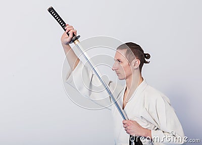 A man with katana on Iaido practice Stock Photo