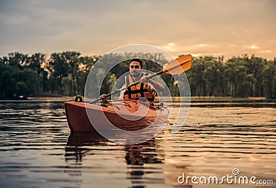 Man and kayak Stock Photo