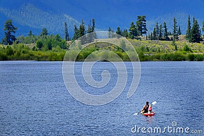 Man on Kayak on Lake Mountains Wilderness Paddling Editorial Stock Photo