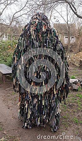 Man in a kikimora camouflage net. Russian-Ukrainian war Stock Photo