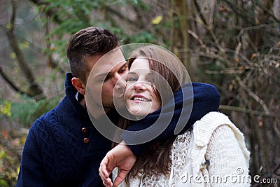 Man kissing woman on the cheek Stock Photo