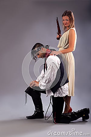 Man kneeling woman musket Stock Photo