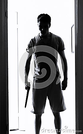 Man with knife silhouette Stock Photo