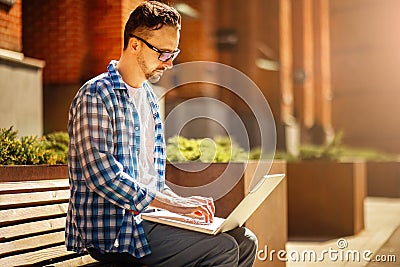 Man with laptop in the street Stock Photo