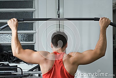 Man on the Lat Pull-Down Machine Stock Photo