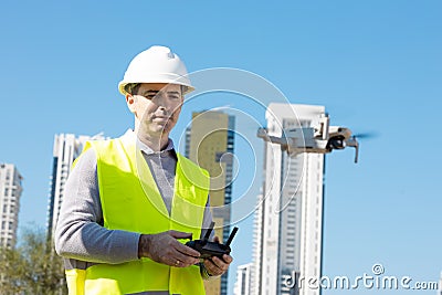 Man launches a quadcopter Stock Photo