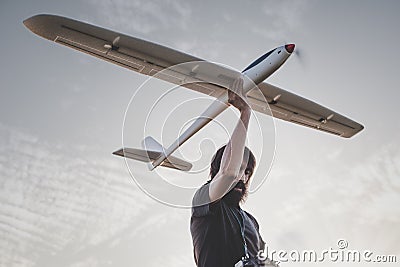 Man launches RC glider into the sky Stock Photo