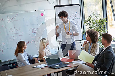 Man leaders present his idea to working team.Business people talking about plan or new project Stock Photo