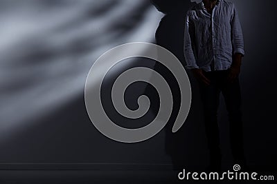 Man leaning against wall Stock Photo