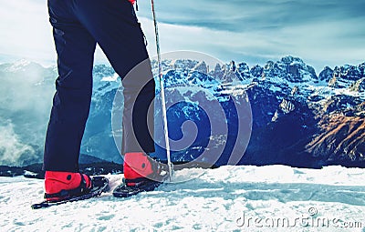 Man legs with snowshoes walk in snow in winter mountains. Stock Photo