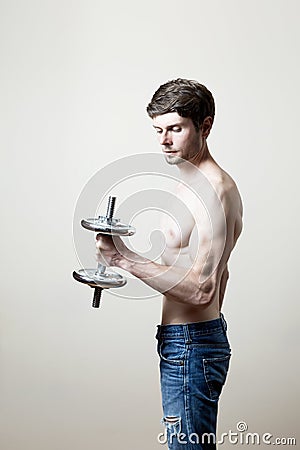 Man lifting dumbbell Stock Photo