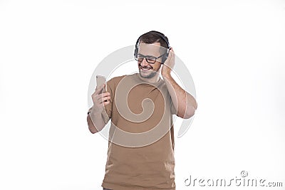 Man Listening to Music from Phone Enjoying It. Man Listening Music Isolated Stock Photo