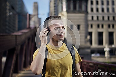 Man while listening to music with wireless headphones Stock Photo