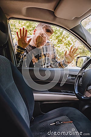 man locked car and forget keys inside Stock Photo