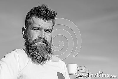 Man with long beard enjoy coffee. Coffee gourmet concept. Bearded man with espresso mug, drinks coffee. Man with beard Stock Photo