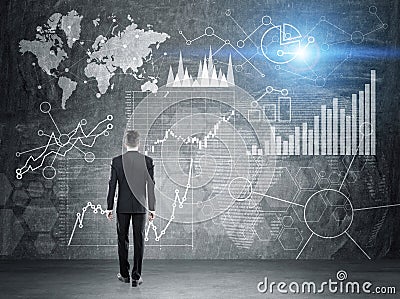 Man looking at business diagrams Stock Photo