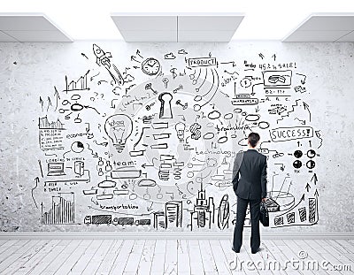 Man looking at business sketch Stock Photo