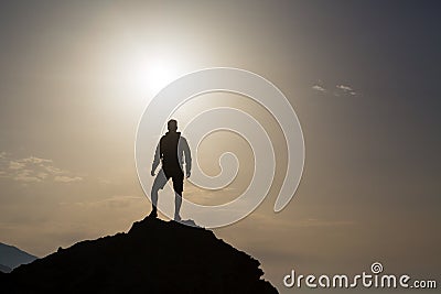 Man looking and celebrating sunrise and landscape Stock Photo