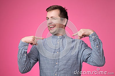 Man looking confident with smile on face pointing with fingers at himself Stock Photo