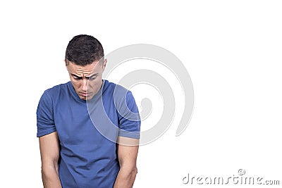 Man looking down at the ground with a guilty look Stock Photo