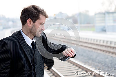 Man is looking on his watch Stock Photo