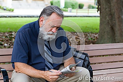 Man Looking At Job Ads Stock Photo