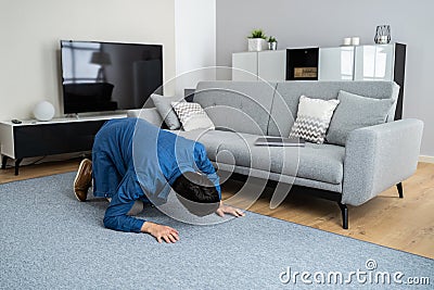 Man Looking For Lost Keys Stock Photo