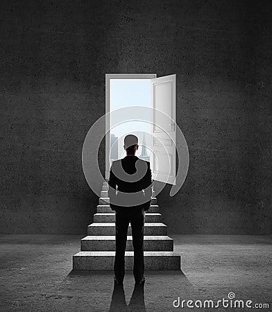 Opened door and ledder Stock Photo